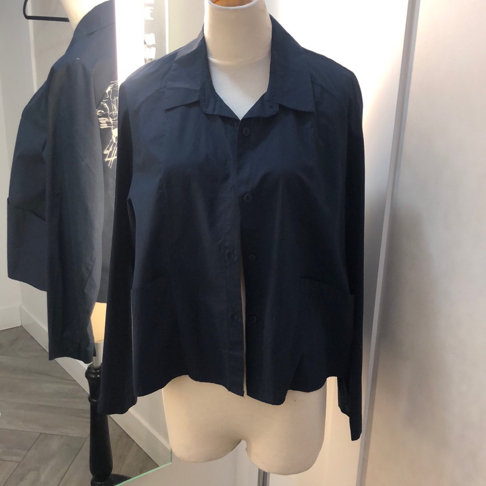 A navy blue buttoned up top